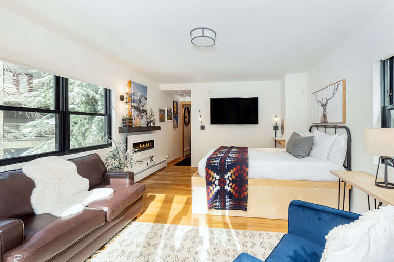 This room also features an electric fireplace for extra cozy ambiance. The sofa is also a sleeper sofa. This room also features an electric fireplace for extra cozy ambiance. The sofa is also a sleeper sofa.