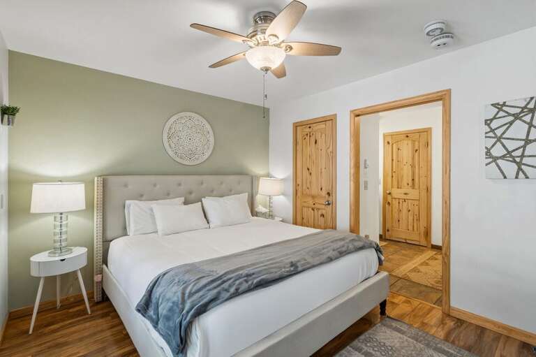 From the bedroom, you'll pass through the hallway with bathroom and closet access to the kitchen and living area.