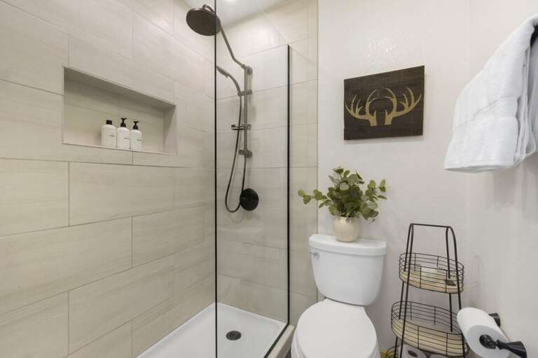 Beautifully remodeled modern bathroom that adds a touch of luxury to your stay.