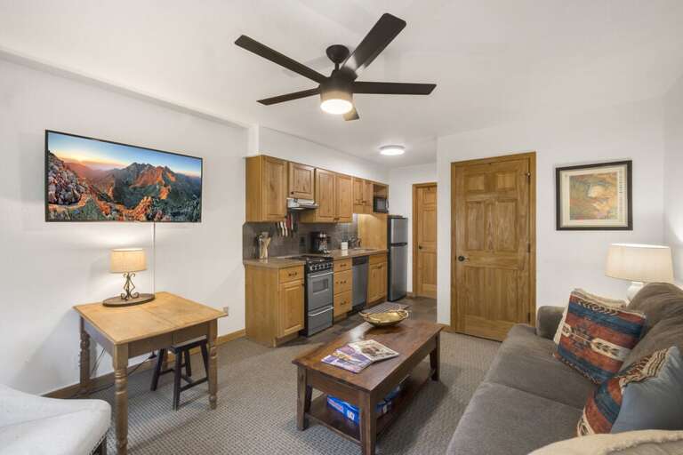 Living area space with kitchen and dining area.
