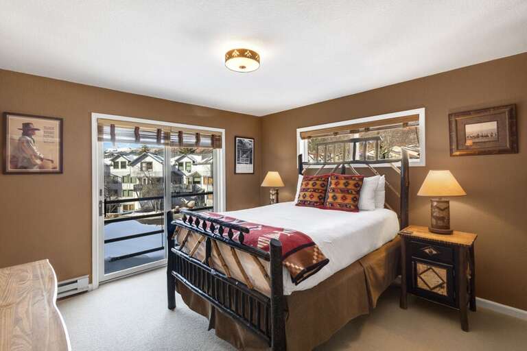 The main bedroom is furnished with a cozy queen bed, flat screen TV, Juliette balcony and plenty of space for your belongings.