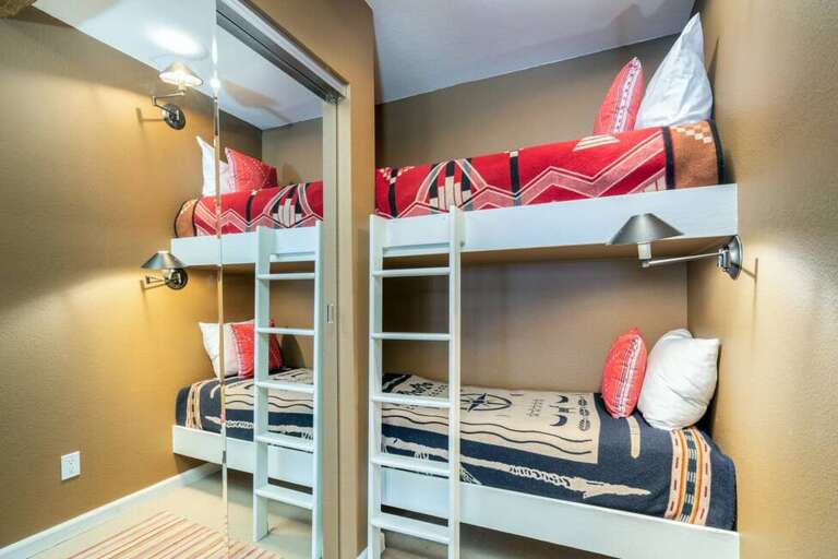 A set of twin bunk beds makes this unit ideal for small families.