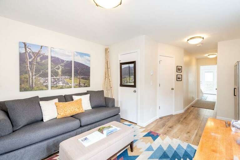 Living area looking into hall that leads to river views.