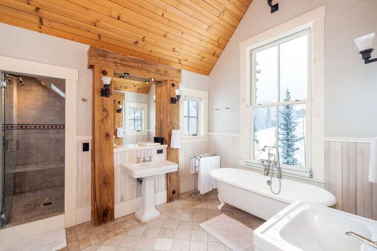 Enjoy a nice soak while watching skiers pass by in the Primary Bathroom