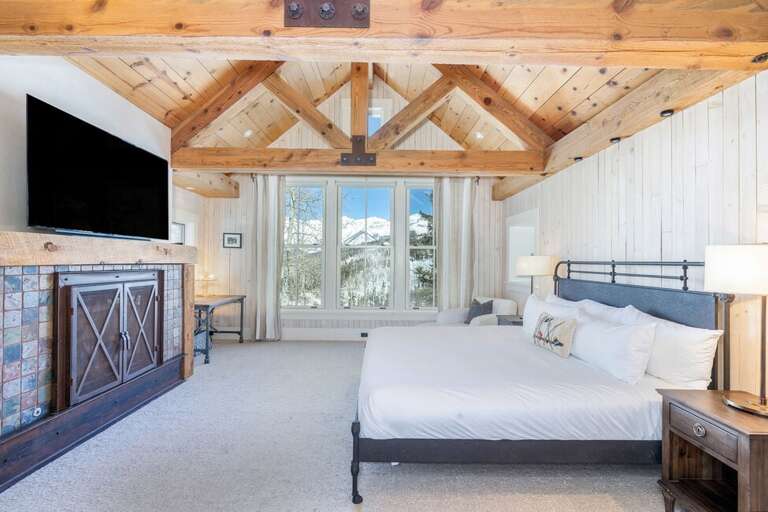 The primary bedroom comes complete with an oversized TV and beautiful views of Telluride's finest peaks.