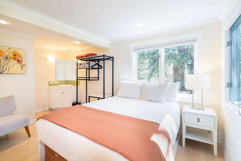 Primary bedroom complete with a queen bed and great views out of the windows.  The Primary features a single sink vanity. Primary bedroom complete with a queen bed and great views out of the windows.  The Primary features a single sink vanity.