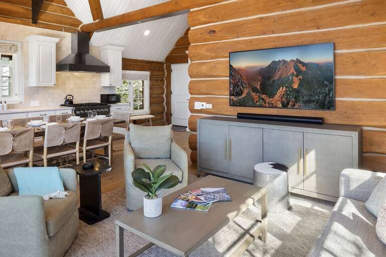 Cozy living area with private deck, gas grill all overlooking the kitchen dining area.