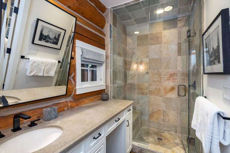 Guest Room One ensuite has a large vanity area and walk-in shower.