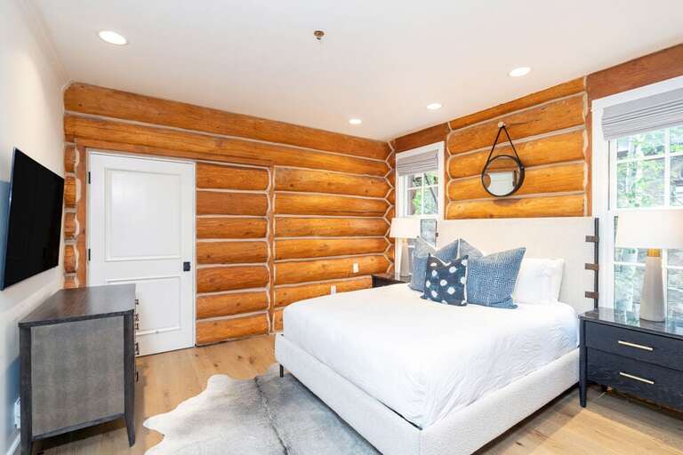 Guest Room One on the main level features a Queen size bed and ensuite bathroom.