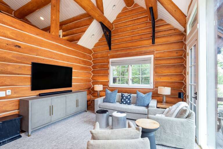 High ceilings and cozy lounging for this contemporary mountain living room.