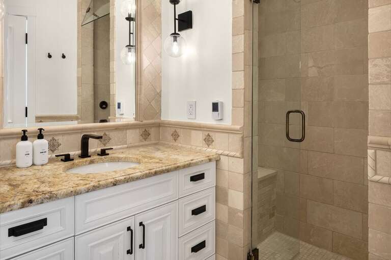 Modern luxury meets comfort in this spa-like bathroom with soaking tub and step-in shower.