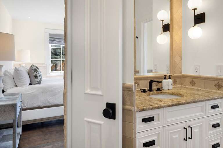 Modern luxury meets comfort in this spa-like bathroom with soaking tub and step-in shower.