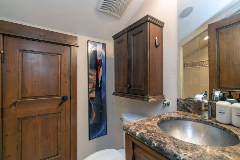 The primary bathroom features a single sink vanity and walk-in steam shower. The primary bathroom features a single sink vanity and walk-in steam shower.