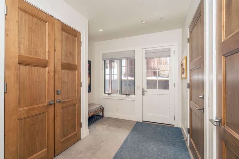 The Entry Level to this unit can be accessed from the garage as well as the east facing entry door.  This Level includes one guest room with ensuite bathroom, Washer and Dryer and coat closet. The Entry Level to this unit can be accessed from the garage as well as the east facing entry door.  This Level includes one guest room with ensuite bathroom, Washer and Dryer and coat closet.