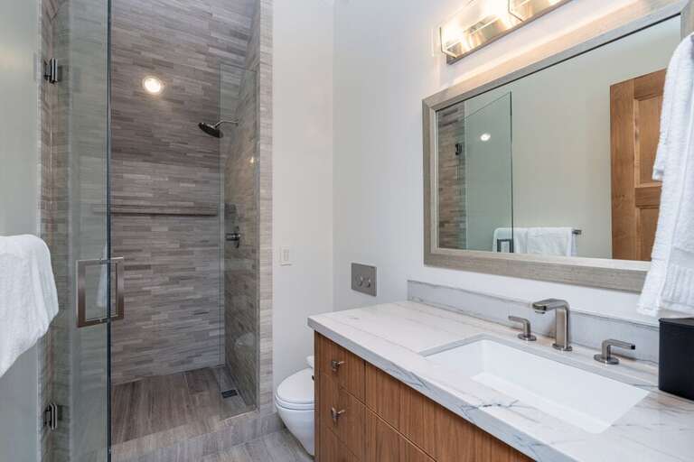 The third level guest bathroom is located just outside the double queen bedroom.  The guest bathroom features a large walk in shower and single vanity. The third level guest bathroom is located just outside the double queen bedroom.  The guest bathroom features a large walk in shower and single vanity.