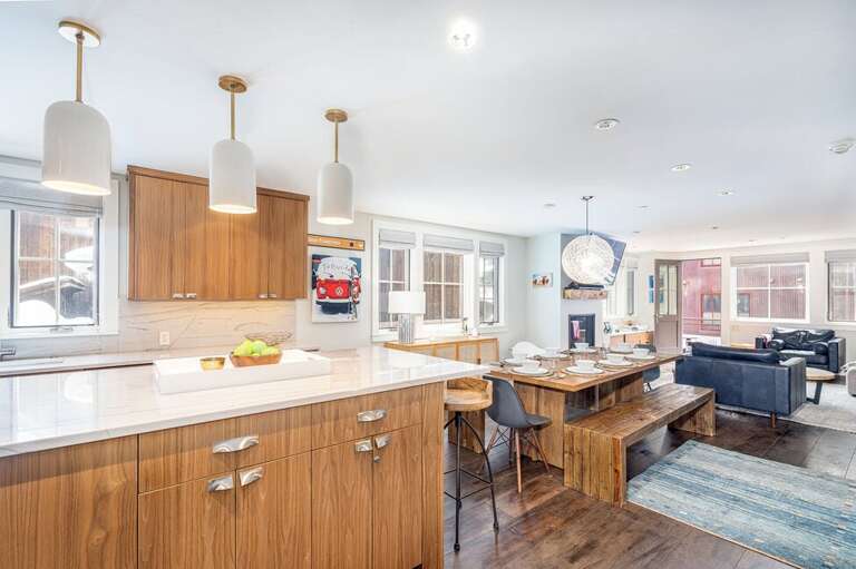 The open living area opens to a balcony where you an enjoy mountain views. The open living area opens to a balcony where you an enjoy mountain views.