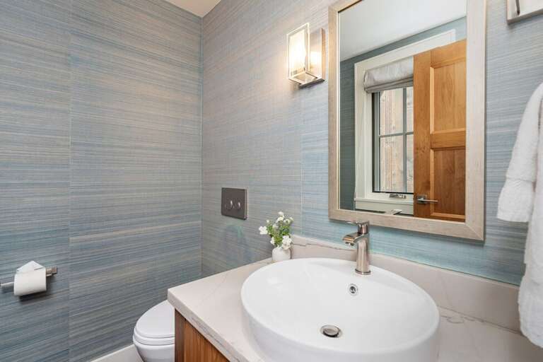 A powder room on the mid-level makes for easy living. A powder room on the mid-level makes for easy living.