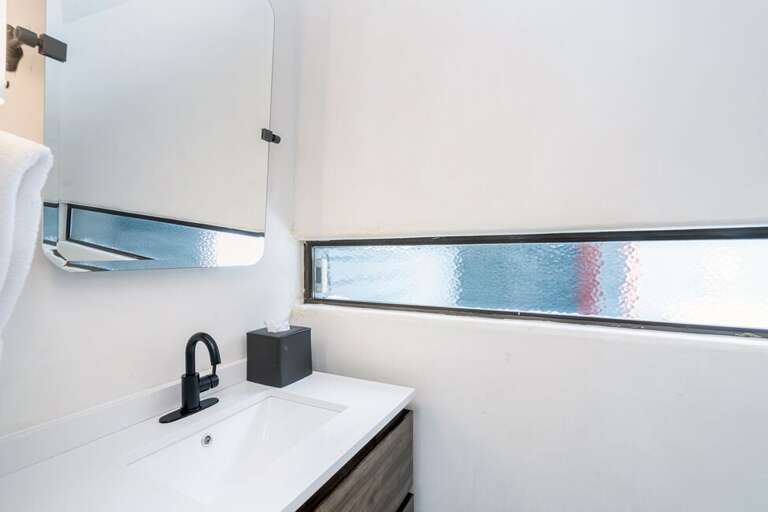 This half bathroom is located at the entry level of the condo.