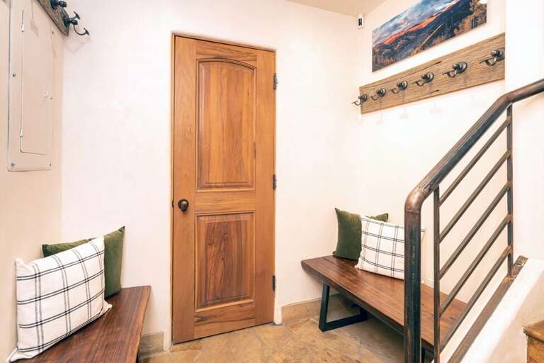 The entry level to this unit features ample storage and coat racks for gear as well a a half bathroom. The entry level to this unit features ample storage and coat racks for gear as well a a half bathroom.