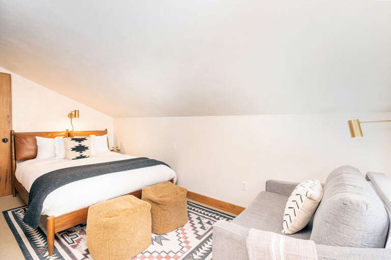 The fourth level of this condo features Guest Room 1.  This cozy room offers a Queen size bed as well a a comfy couch for relaxing. The fourth level of this condo features Guest Room 1.  This cozy room offers a Queen size bed as well a a comfy couch for relaxing.