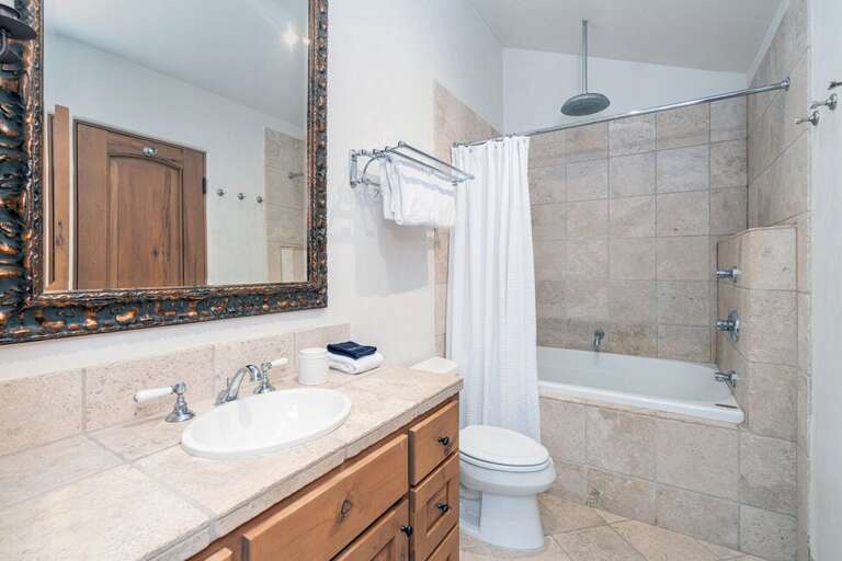 The fourth level of this condo also features the shared bathroom between level four and five. Shower/tub combo, 1 sink vanity with lots of space. The fourth level of this condo also features the shared bathroom between level four and five. Shower/tub combo, 1 sink vanity with lots of space.