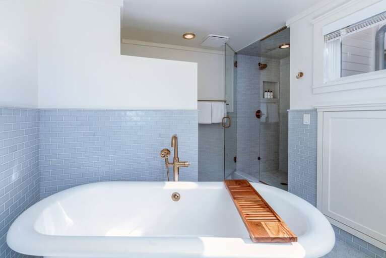 Beautifully Decorated Primary ensuite with Large Soaking Tub, step in shower and double Vanity.