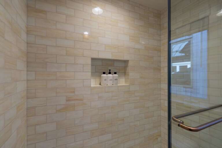 Beautifully tiled shower tub combo is an inviting place to relax after a fun day on the Mountain.