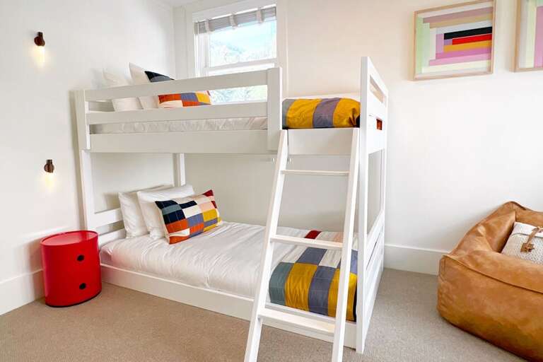 Bunk room two features 2 twin beds and a cozy leather bean bag for realxing.
