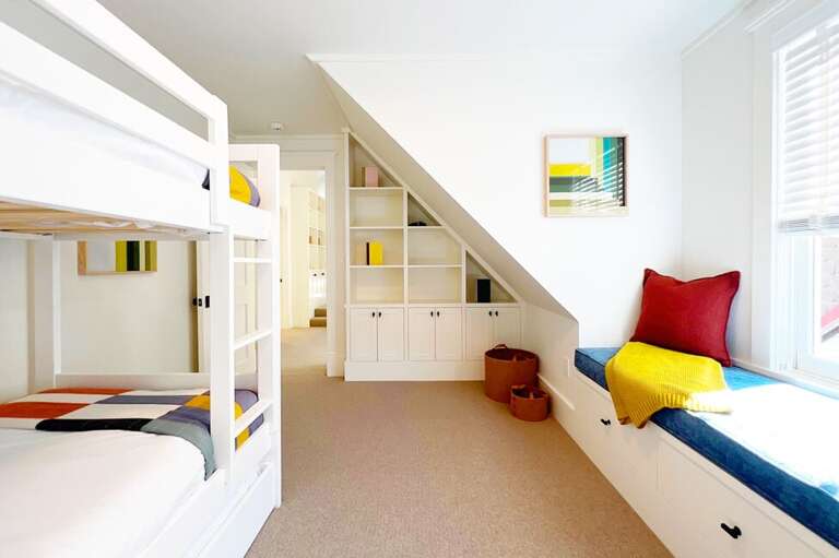 Bunk room One features two twin beds ( trundle bed provides additional twin bed), a reading bench and shelving for clothes and toys.