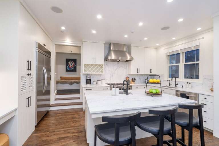 Custom designed chefs Kitchen featuring high-quality appliances, elegant finishes and ample storage space.