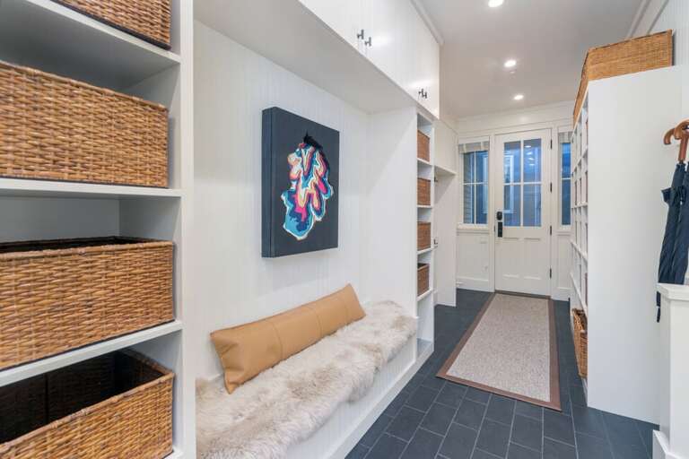 At the east end of Depot, a second entry door leads into the mudroom—thoughtfully designed with ample hooks and baskets to store all your gear.