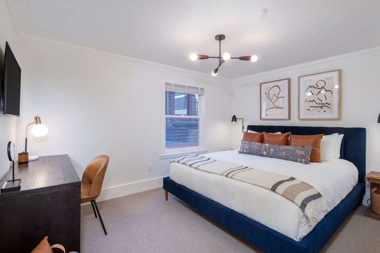 The second Guest Room located to the left as you reach the top of the stairs, has a California King and provides ample space for all your amenities.