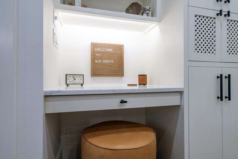 This kitchen desk area is the perfect place to leave keys, mail, or grocery bags.