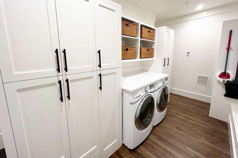 The laundry/pantry room is located off the large mud room on the main level and right next to the kitchen.  This area has lots of storage space for food and supplies.