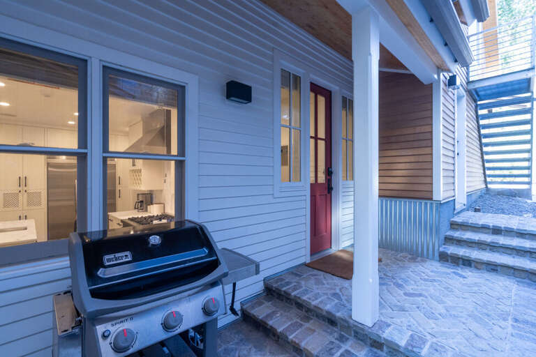 This Luxury home features a side patio area with a gas grill and is easily accessed fro the mud room and Kitchen entrances.