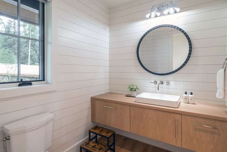 Right off the entry door, you will find a spacious powder room for guests and family.