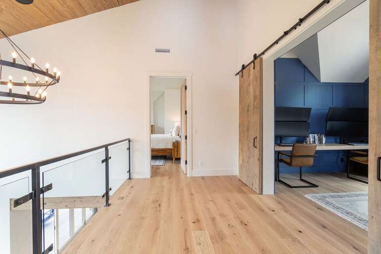 The second levels also home to an open balcony space overlooking the Great Room as well as the office and Gaming room.