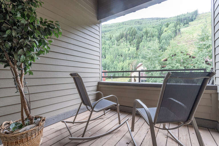Off the main bedroom,  the outdoor private porch has plenty of room to chill and enjoy the mountain air and views.