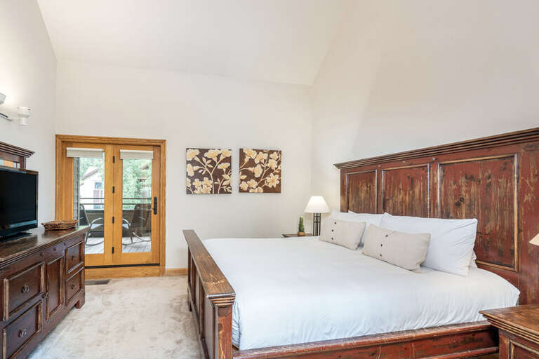 Main suite is located on the second floor, up a flight of stairs.  King bed with en suite bathroom.