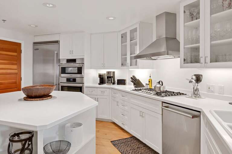 Sleek Stainless Steel Kitchen With Pristine White Cabinetry
