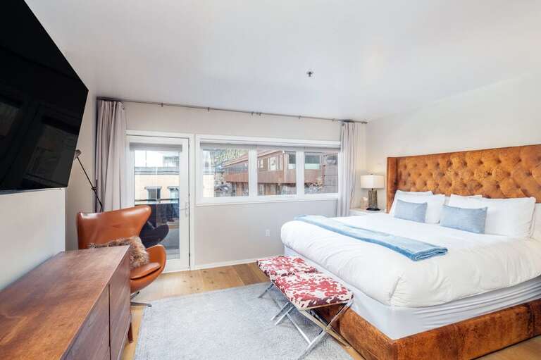 Primary suite with King bed and en suite bathroom.  Door opens to your private adjoining deck.