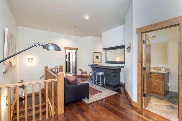 Second floor landing provides a great space to entertain and enjoy a beverage after a fun day.