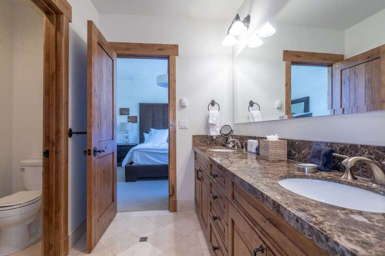 Spacious ensuite with water closet, his and hers vanity, soaking tub and step in shower.
