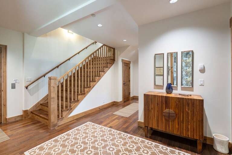 The entry Level consists of two guest bedrooms with ensuite bathrooms and fully equipped laundry room.