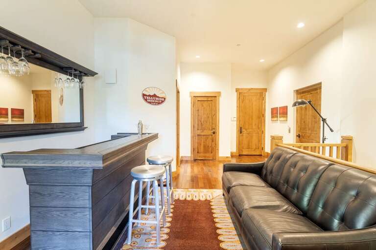 Unique bar area for serving drinks and hanging out located on the second level of the unit.