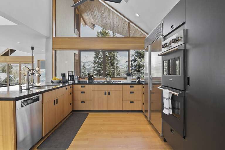 Beautiful gourmet kitchen  five burner gas stove. Modern appliances for all your cooking needs.