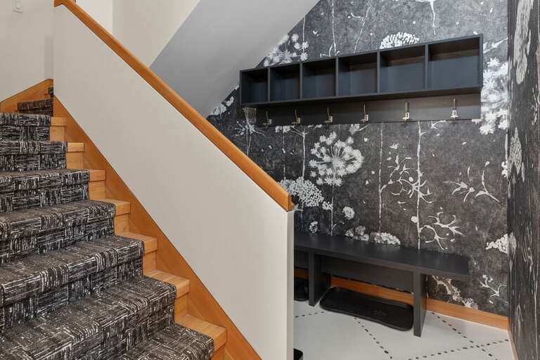 The entry level features an ideal space for boots and Jackets.