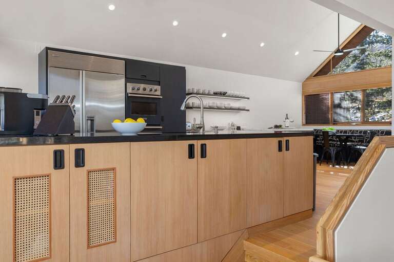 The gourmet kitchen is a level above the dining and living area allowing great views of everything going on.