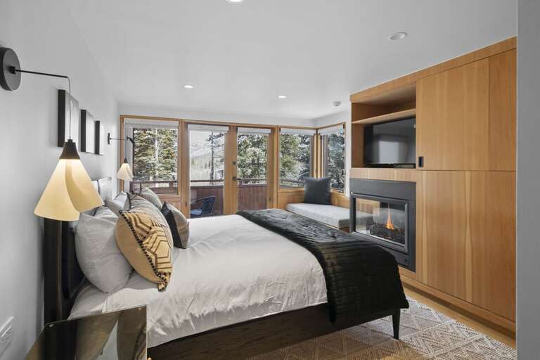 Guest Room One features a King Bed, gas fireplace and private deck as well as an ensuite bathroom.