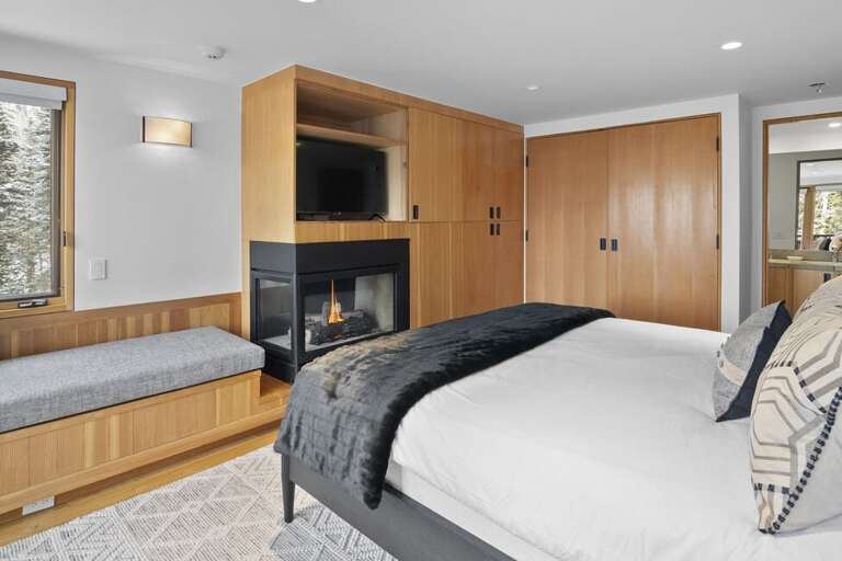 This guest room offers ample closet space a cozy reading nook and a gas fireplace to cozy up to as you get ready to sleep.